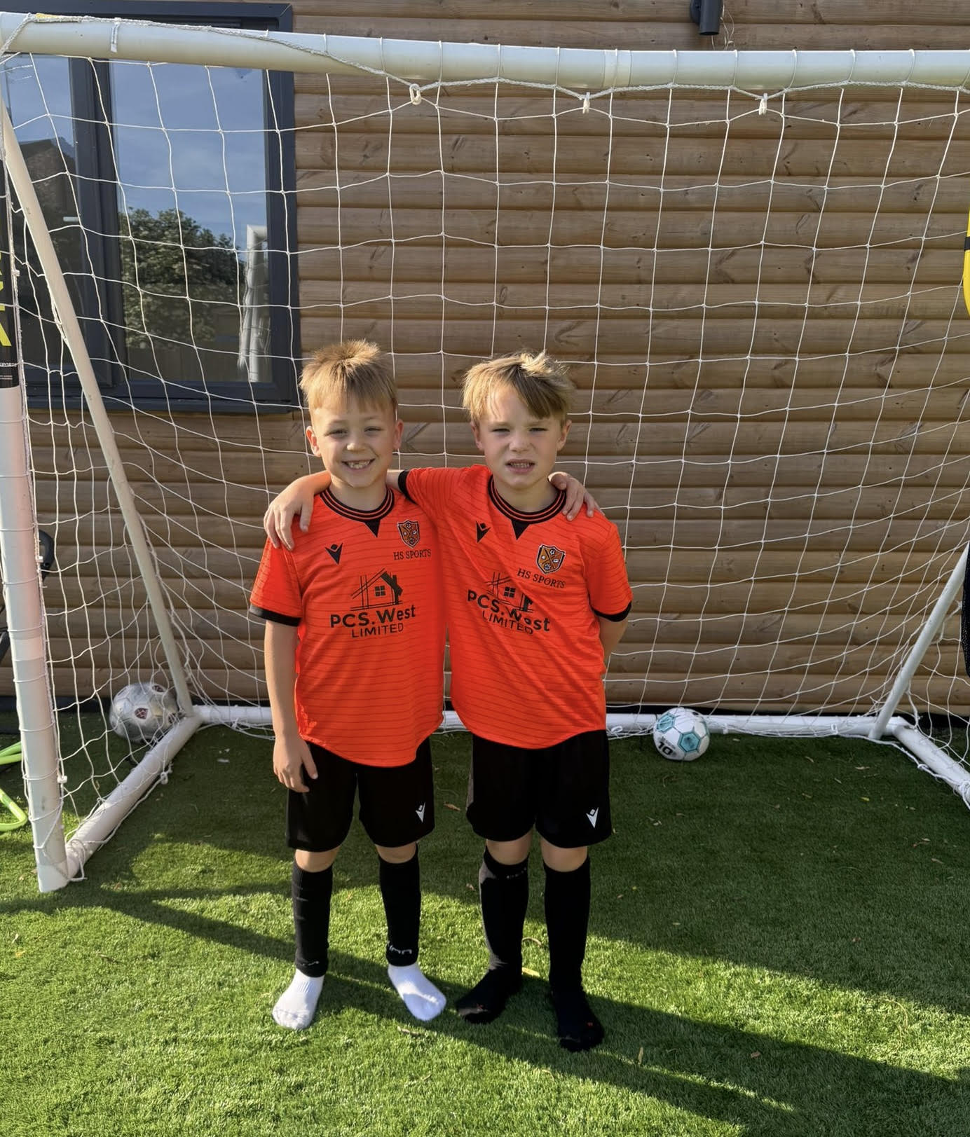 HS Sports Dortmund under 7's in their orange PCS.West Limited kits