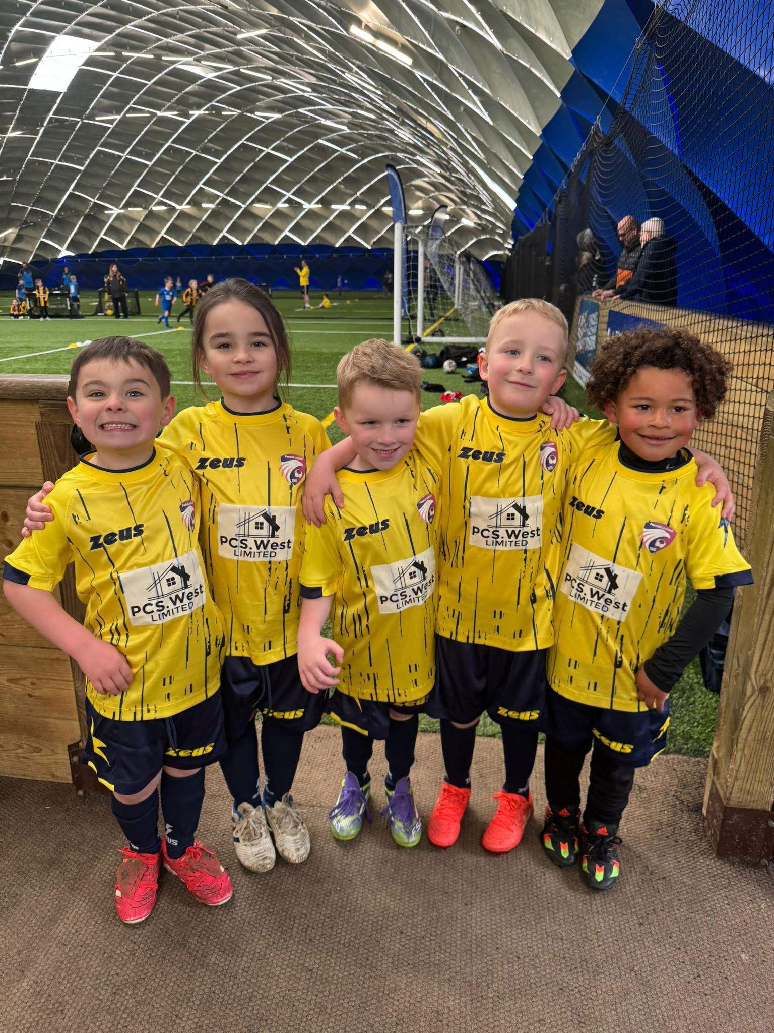 Penhill Utd under 6's in their yellow PCS.West Limited kits