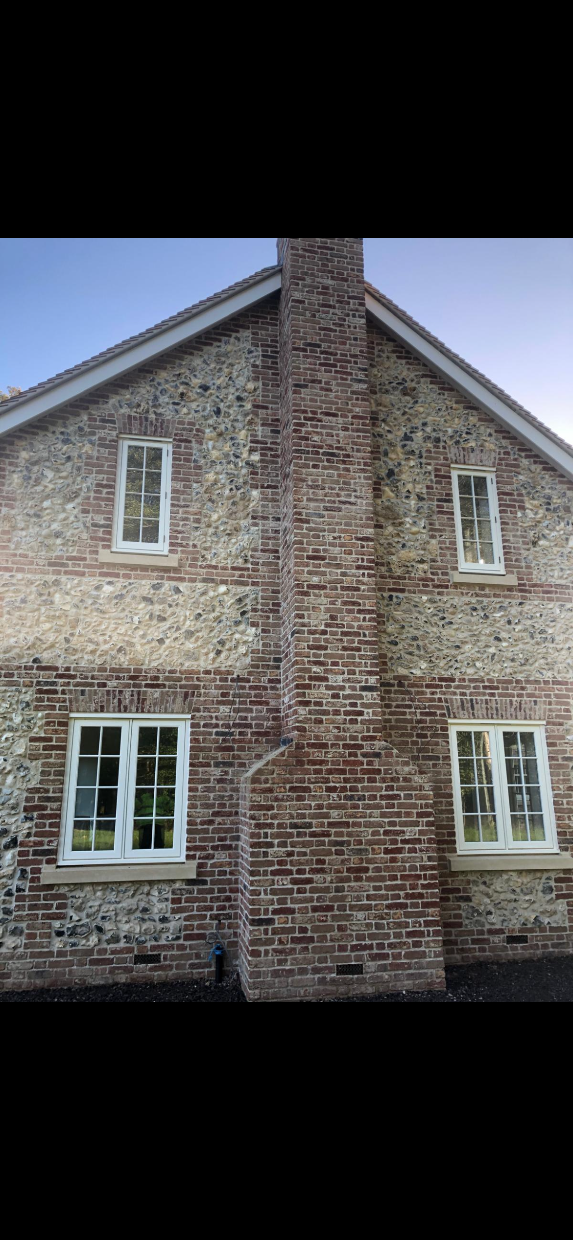 Brick and flint house with chimney