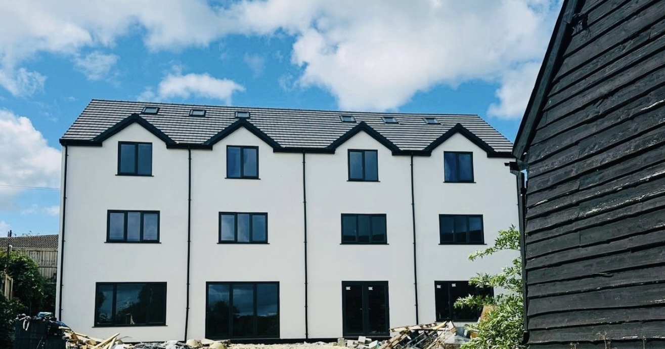 White rendered residential development