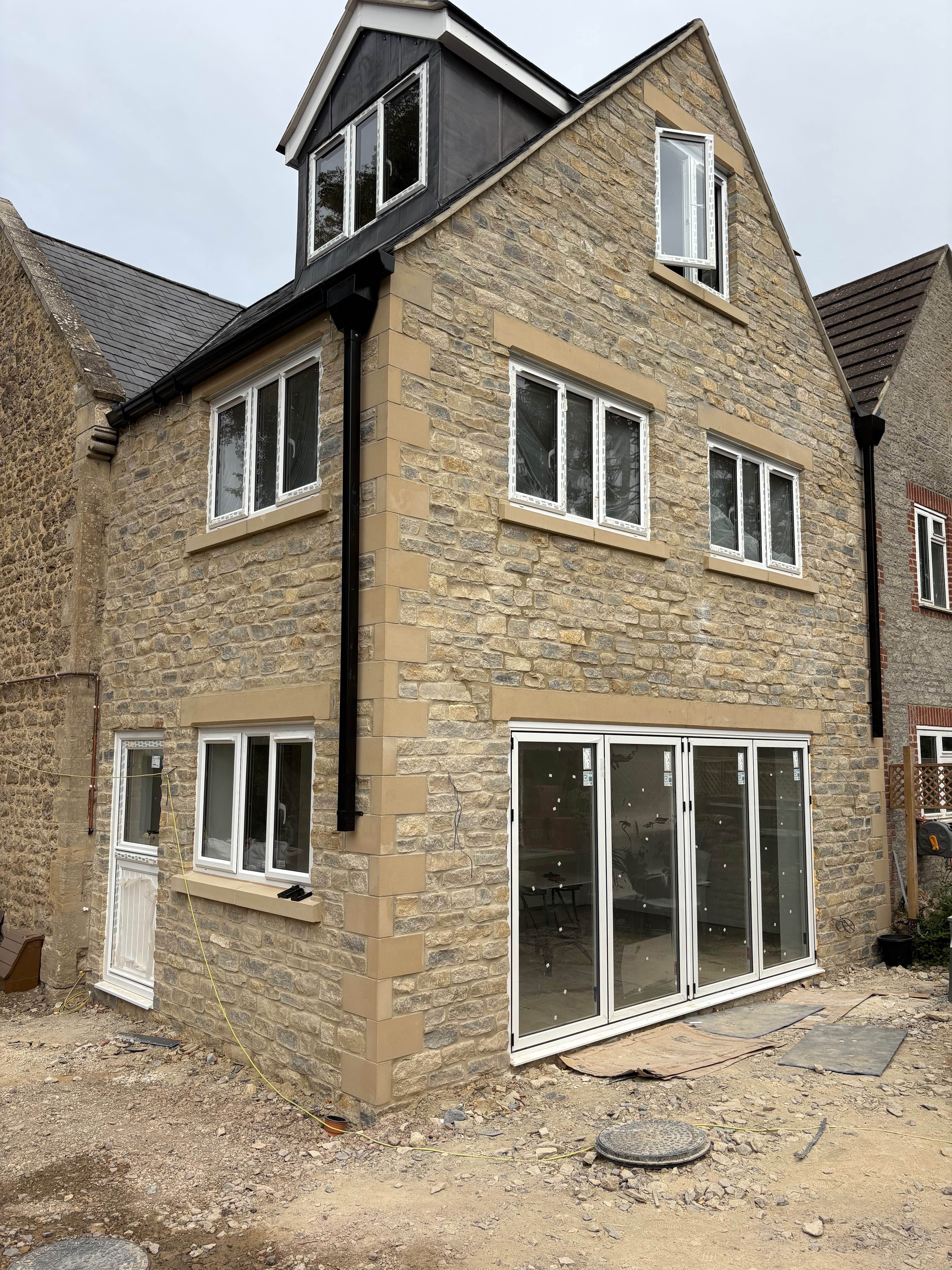 Cotswold stone house with bi-fold doors